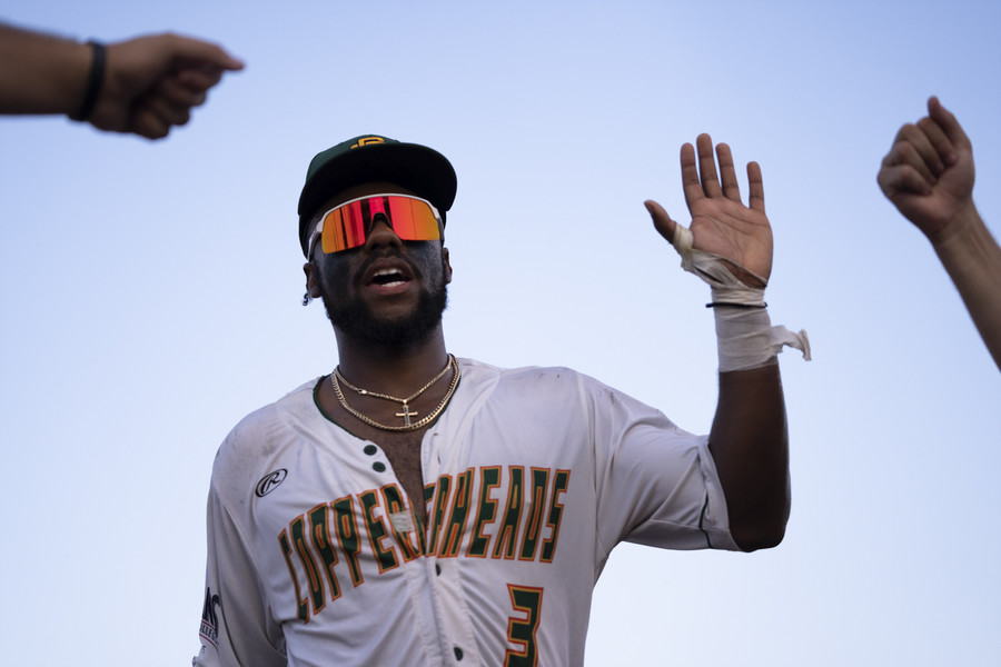 Student Photographer of the Year - Second Place, Joe Timmerman / Ohio UniversitySouthern Ohio Copperheads right fielder Trey Rucker (3) high fives teammates during a Great Lakes Summer Collegiate League game against the Sandusky Ice Haulers. 