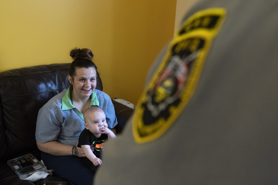 Feature Picture Story - Second Place, “ABCs Nursery Program”Morgan Brodt talks with Corrections Officer Ernest Vehorn while holding her son, Axel, inside of the Hope House at the Ohio Reformatory for Women, in Marysville. “Whenever we get somebody in over [here], the line I always use is, ‘If you’re going to be in this place, you just won the lottery,’” Vehorn said.  (Joseph Scheller / Ohio University)