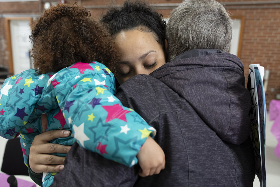 Feature Picture Story - Second Place, “ABCs Nursery Program”Abby Small (center) hugs her mother and daughter after saying goodbye after a family visitation day for inmates in the ABCs program at the Ohio Reformatory for Women in Marysville.  (Joseph Scheller / Ohio University)