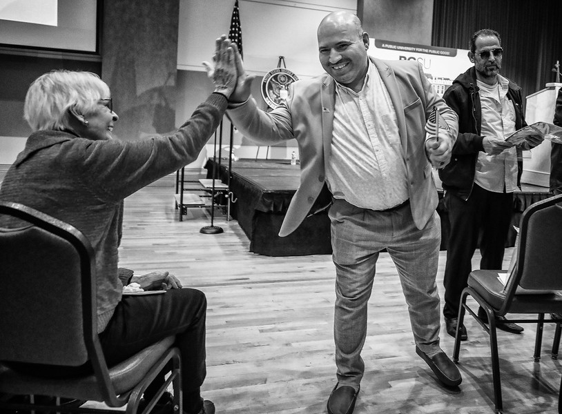 Feature Picture Story - Third Place, “Naturalization Ceremony”Mohammed Aji, originally from Syria, high fives Janet Parks of the League of Women Voters after becoming a US citizen during a Naturalization ceremony at the Bowling Green State University Student Union in Bowling Green.  (Jeremy Wadsworth / The Blade)