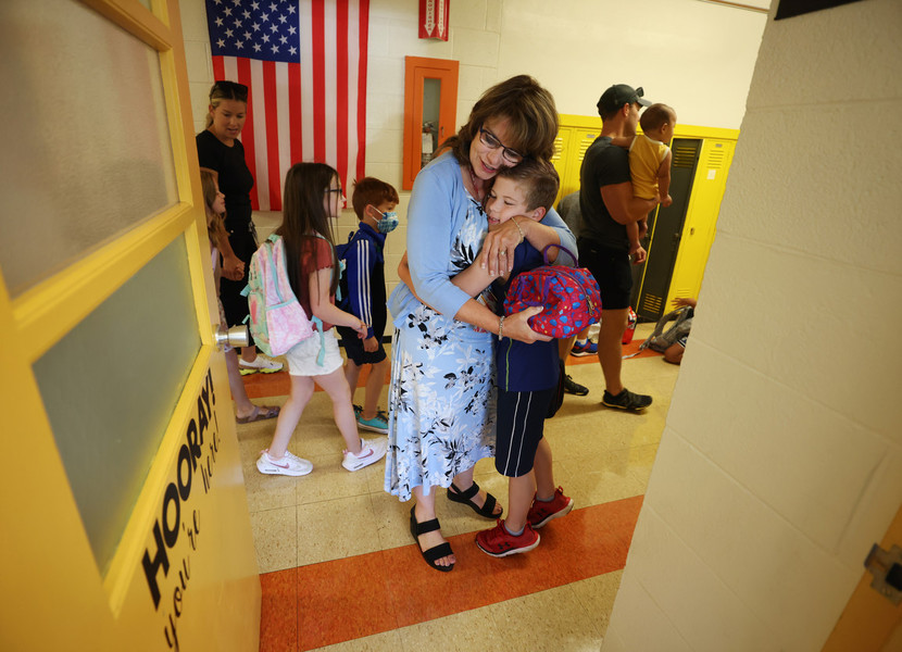 General News - First Place, “Welcome Back”Teacher Michelle Waddell welcomes Austin Skiver, 8, with a hug on the first day of class for third graders at Frank Elementary School, in Perrysburg.  (Dave Zapotosky / The Blade)
