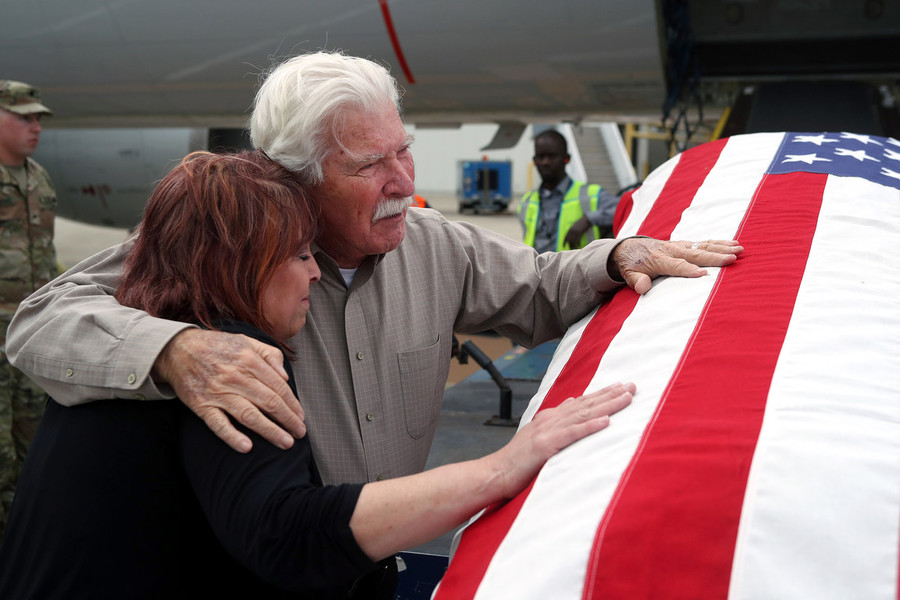 News Picture Story - Second Place, “Korean War Vet”David Lilley, of Westerville, and Melanie Clifford, of Pigeon Forge, Tennessee share an emotional moment together after receiving the remains of Korean War Army veteran private first class Jack E. Lilley from an American Airlines flight from Honolulu on June 10, 2022, at John Glenn Columbus International Airport. Pfc. Lilley, who is David's brother and Melanie's second cousin, was killed during the war on July 20, 1950 and was reported missing in action before his remains were identified Nov. 5, 2021.  (Shane Flanigan / ThisWeek Community News)