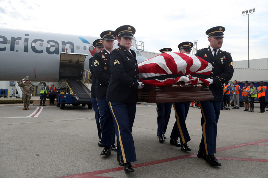 News Picture Story - Second Place, “Korean War Vet”Members of the Ohio Army National Guard Honor Guard Team carry the remains of Korean War Army veteran private first class Jack E. Lilley to an awaiting hearse from an American Airlines flight from Honolulu on June 10, 2022, at John Glenn Columbus International Airport. Pfc. Lilley was killed during the war on July 20, 1950 and was reported missing in action before his remains were identified Nov. 5, 2021.  (Shane Flanigan / ThisWeek Community News)