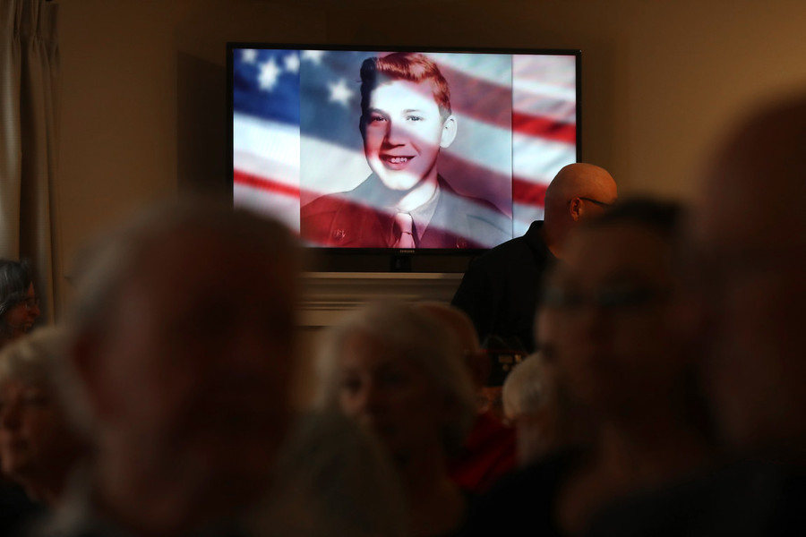 News Picture Story - Second Place, “Korean War Vet”An image of Korean War Army veteran private first class Jack E. Lilley is shown while guests pay their respects during a service held at Hill Funeral Home on June 14, 2022, in Westerville.   (Shane Flanigan / ThisWeek Community News)