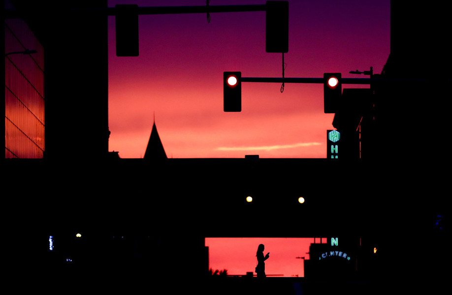 Pictorial - Award of Excellence, “Sunset”A pedestrian crosses Jefferson Avenue at Summit Street as the sunset glows behind in Toledo. (Kurt Steiss / The Blade)