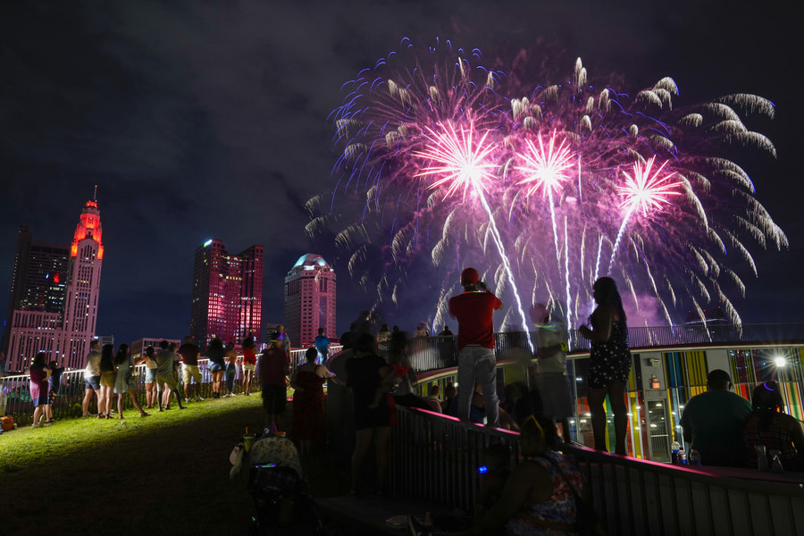 Photographer of the Year - Large Market - First Place, Adam Cairns / The Columbus DispatchSpectators watch from the top of the National Veterans Memorial and Museum as fireworks light up the downtown skyline during the annual Red, White & Boom celebration of Independence Day in Columbus. 