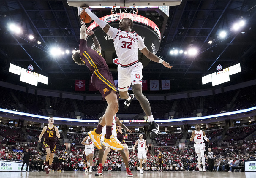 Photographer of the Year - Large Market - First Place, Adam Cairns / The Columbus DispatchOhio State Buckeyes forward E.J. Liddell (32) blocks the shot of Minnesota guard Sean Sutherlin (24) during the first half of the NCAA basketball game at Value City Arena in Columbus. 