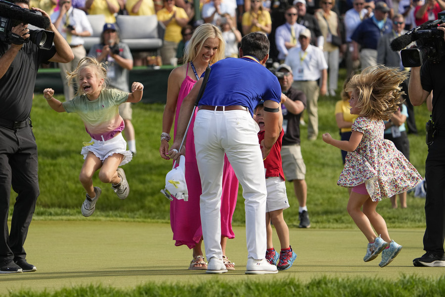 Photographer of the Year - Large Market - First Place, Adam Cairns / The Columbus DispatchBilly Horschel's family rushes out to greet him after he wins the Memorial Tournament at Muirfield Village Golf Club. 