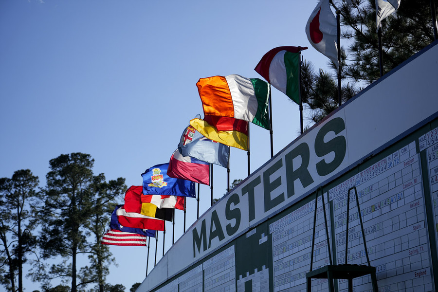 Photographer of the Year - Large Market - First Place, Adam Cairns / The Columbus DispatchA tradition like no other, the Masters golf tournament was held in Augusta, Georgia the week of April 3. Golfers from around the world are invited to participate in the exclusive major tournament. The immaculately groomed course provides a unique experience for players and patrons alike. Flags on top of the Masters scoreboard blow in the wind during the first round of The Masters golf tournament at Augusta National Golf Club.  