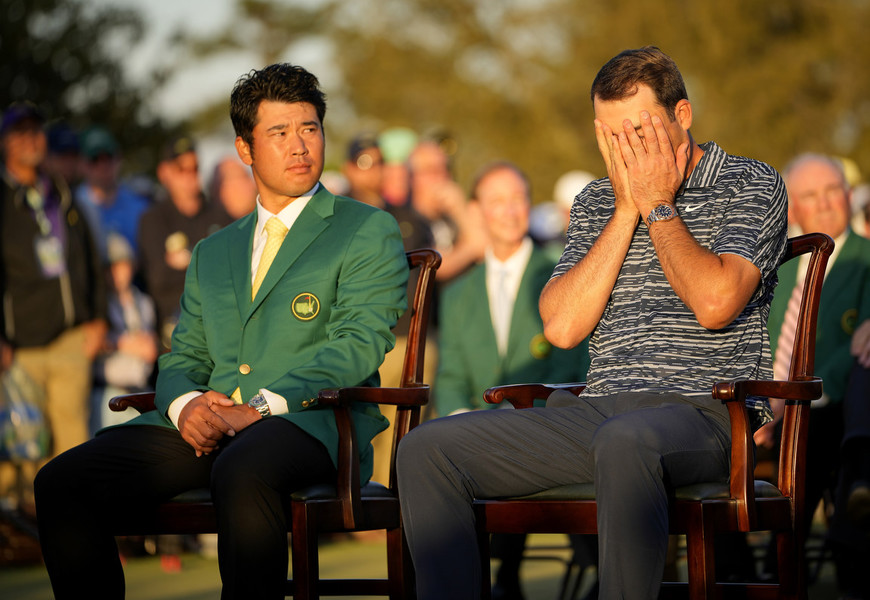 Photographer of the Year - Large Market - First Place, Adam Cairns / The Columbus DispatchFollowing his tournament win, Scottie Scheffler covers his face while sitting next to 2021 champion Hideki Matsuyama at the green jacket ceremony during the final round of the Masters Tournament at Augusta National Golf Club.  
