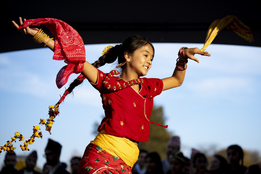 Photographer of the Year - Large Market - Award of Excellence, Joseph Scheller / Ohio UniversityKhushi Gurung, 12, dances during a Tihar festival organized by the Bhutanese Nepali community of Greater Columbus at Civic Park in Reynoldsburg. 