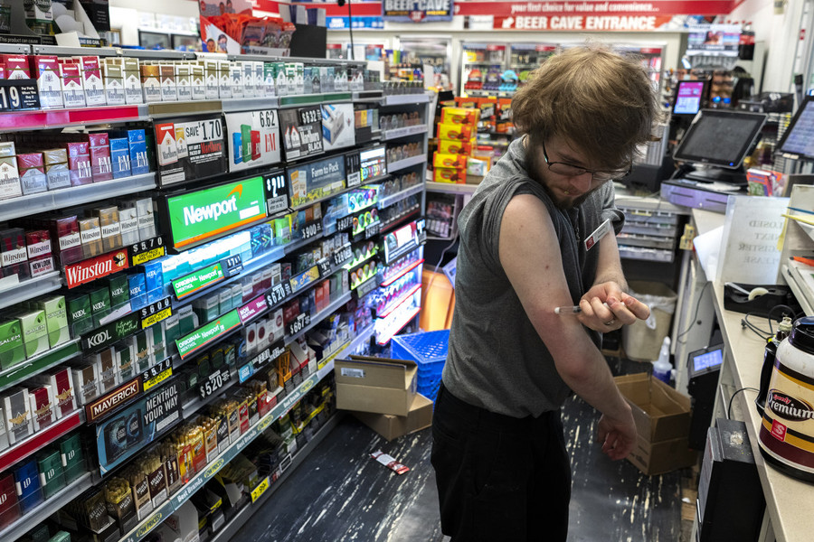 Photographer of the Year - Large Market - Award of Excellence, Joseph Scheller / Ohio UniversityDakota Sheets, a Type 1 diabetic, injects insulin into his arm while working an overnight shift at a Speedway in Athens. “I’m technically supposed to be taking it in the back, but I can’t wait 30 minutes, half an hour, three hours to take it,” Sheets said. “If I don’t take my insulin I can possibly get very sick.” 