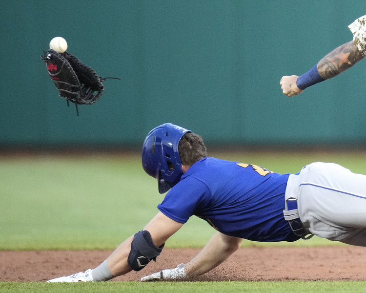 Photographer of the Year - Large Market - Award of Excellence, Joseph Scheller / Ohio UniversityOmaha Storm Chasers catcher Jakson Reetz (25) knocks the glove off of Columbus Clippers infielder Gabriel Arias (13) as he slides into second base at Huntington Park in Columbus. 