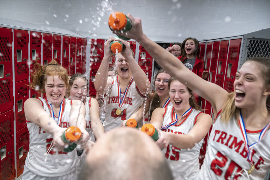 Photographer of the Year - Large Market - Award of Excellence, Joseph Scheller / Ohio UniversityTrimble Lady Cats teammates douse Joe Richards, their head coach, in water after winning the Dvision IV district championship game 62-47 against the South Webster Lady Jeeps, in Piketon. 