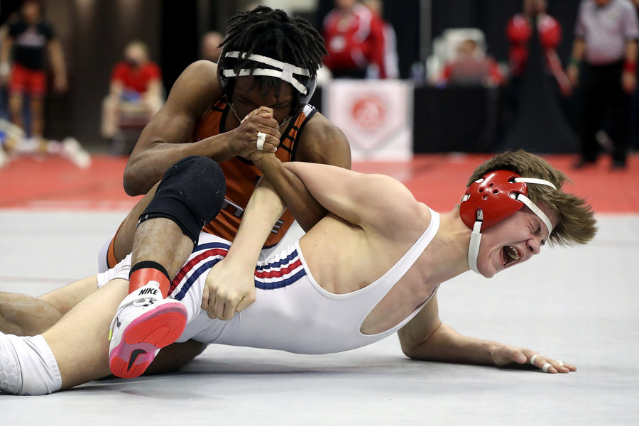Photographer of the Year - Small Market - First Place, Shane Flanigan / ThisWeek Community NewsHartley's Aiden King yells out as he struggles to break free from Ashland's Roman Parobek in their 120-pound match during the OHSAA Division II state wrestling tournament at the Schottenstein Center in Columbus.. 