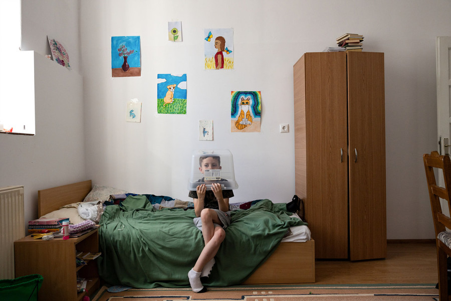 Portrait Personality - Second Place, “Ukrainian in Romania”Vladislav Nikolaiev, 7, of Sumy, Ukraine, sits in the main room of his family's apartment in Oradea, Romania on June 12, 2022. Nikolaiev's parents have tried to create some form of stability for their children since fleeing Sumy, Ukraine, and have encouraged the kids to create, like they did back in Ukraine. (Stephen Zenner / The Blade)