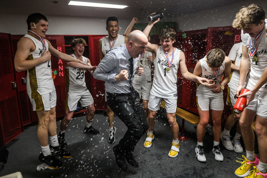 Sports Feature - Award of Excellence, “Coach”Northview’s Jeremy McDonald (center) dances as the team sprays him with water after winning the Division I district championship against Whitmer at Central Catholic High School in Toledo. (Isaac Ritchey / The Blade)