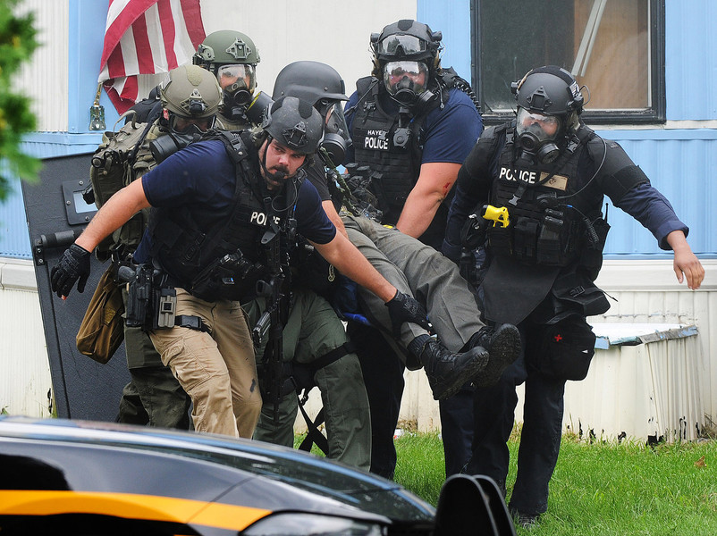 Spot News - First Place, “Deputy Rescue”Members of a combined SWAT team rescue wounded deputy Matthew Yates after he was shot in the Harmony Estates Mobile Home Park while responding to a domestic violence call.  (Marshall Gorby / Dayton Daily News)