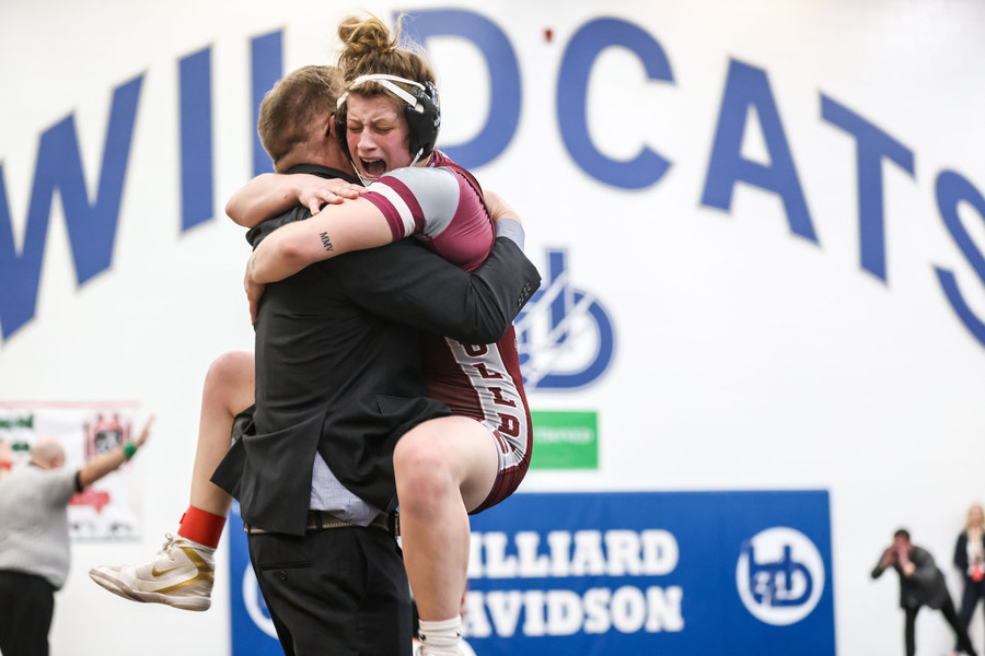 Ron Kuntz Sports Photographer of the Year - Second Place Rossford Bulldogs wrestler Zoe Hussar jumps into her father and coach Randy Hussar’s arms after defeating her opponent North Bend Taylor’s Meghan Werbrich to place first in the OHSWCA Girls State Wrestling Championships 145 final match at Hilliard Davidson High School in Hilliard.  (Isaac Ritchey / The Blade)