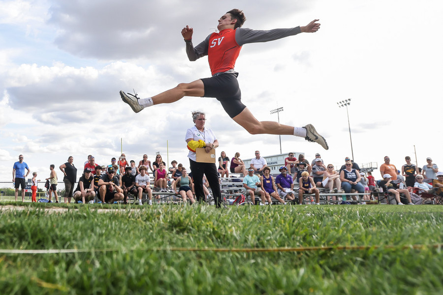 Ron Kuntz Sports Photographer of the Year - Second Place Southview’s Logan Howe competes in ong jump during the Northern Lakes League track and field championships at Napoleon High School in Napoleon.   (Isaac Ritchey / The Blade)