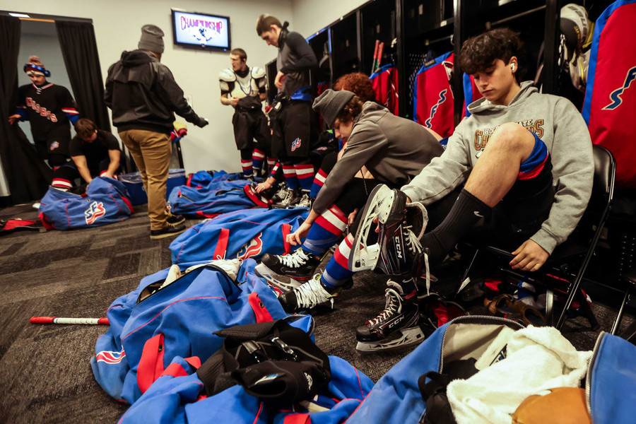 Ron Kuntz Sports Photographer of the Year - Second Place St. Francis De Sales’s Kyle Owczarzak (right) puts on his skates before the OHSAA state hockey championship game against Gates Mills Gilmour at Nationwide Arena in Columbus.  (Isaac Ritchey / The Blade)
