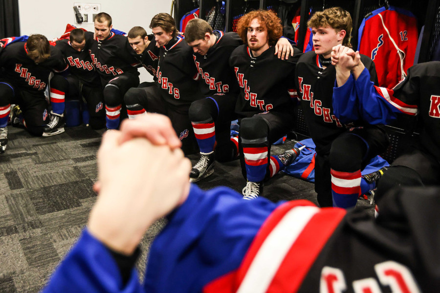 Ron Kuntz Sports Photographer of the Year - Second Place St. Francis De Sales prays before the OHSAA state hockey championship game against Gates Mills Gilmour at Nationwide Arena in Columbus.   (Isaac Ritchey / The Blade)