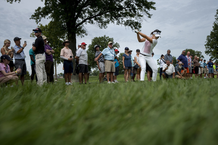 Ron Kuntz Sports Photographer of the Year - Third Place Jeongeun Lee6 hits an approach shot out of the rough on the 12th hole of the Kendale Course during the third round of the Kroger Queen City Championship presented by P&G at the Kenwood Country Club in Madeira.  (Albert Cesare / The Cincinnati Enquirer)