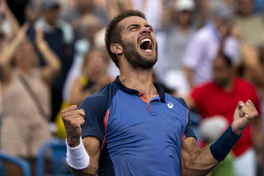 Ron Kuntz Sports Photographer of the Year - Third Place Borna Coric celebrates after winning the Western & Southern Open men’s final match at the Lindner Family Tennis Center in Mason, Ohio. Borna Coric defeated Stefanos Tsitsipas 7-6, 6-2.  (Albert Cesare / The Cincinnati Enquirer)