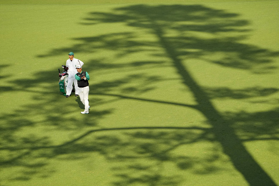 Sports Picture Story - Third Place, “The Masters”Hideki Matsuyama hits his approach shot on the 15th hole during the third round of The Masters golf tournament at Augusta National Golf Club.  (Adam Cairns / The Columbus Dispatch)