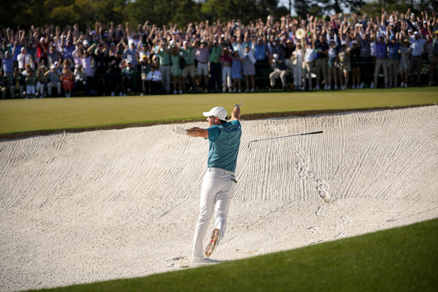 Sports Picture Story - Third Place, “The Masters”Rory McIlroy reacts after holing out of the bunker for a birdie on the 18th hole during the final round of the Masters Tournament at Augusta National Golf Club.   (Adam Cairns / The Columbus Dispatch)