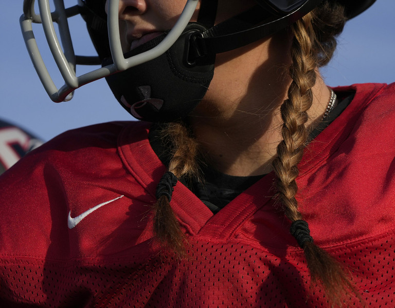 Sports Picture Story - Second Place, “Columbus Chaos”Braids hang out of the helmet of Amanda Herbst who plays for the Columbus Chaos women's football team during practice. The team plays in Division II of the full-tackle Women's Football Alliance. They had twenty-eight players on their roster in 2022 and finished with a record of 1-5.  (Barbara J. Perenic / The Columbus Dispatch)