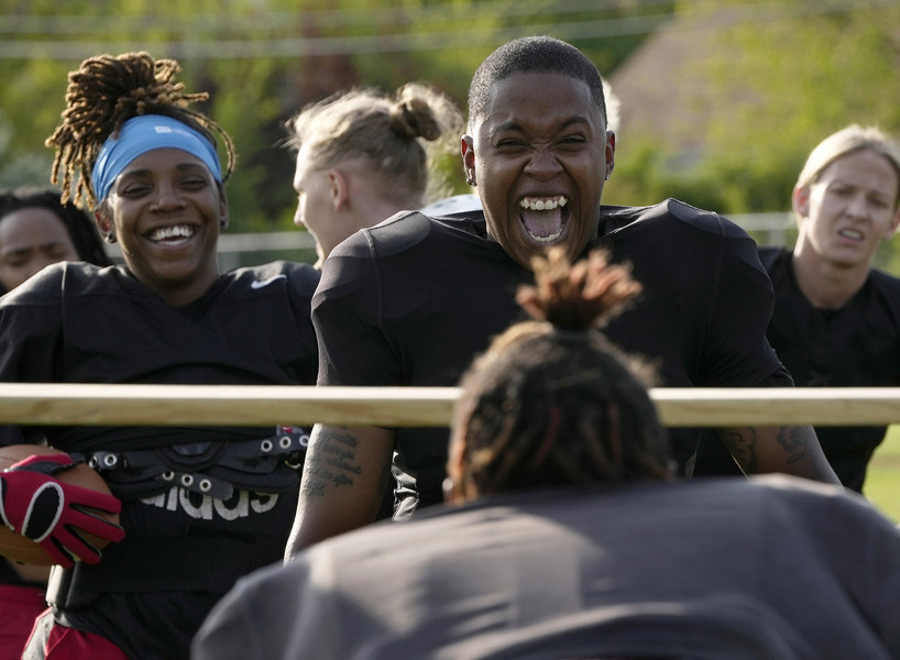 Sports Picture Story - Second Place, “Columbus Chaos”DeAsha Talley and Ayshia Slaughter of the Columbus Chaos laugh as a teammate struggles to crouch low enough to get under a bar during a limbo-like drill at practice. (Barbara J. Perenic / The Columbus Dispatch)