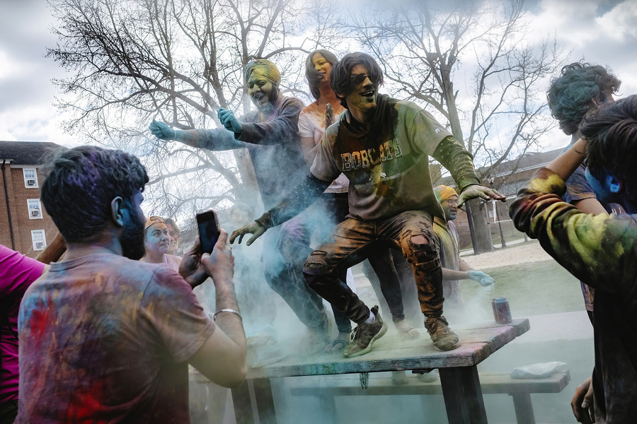1st - Chuck Scott Student Photographer of the Year Students Prabhleen Singh Bedi, Sonali Jha, and Harshwardhan Lnu dance on top of a picnic table amid colored powder to celebrate Holi, the Hindu festival of color, at the South Green portion of Ohio University's campus in Athens, Ohio, on Saturday March 4, 2023. The event, which was previously on suspended for three consecutive years due to the COVID-19 pandemic, was organized by the Indian Student Organization.  (Loriene Perera / Ohio University)