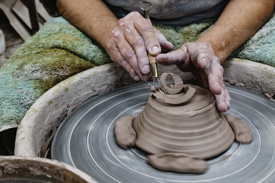1st - Chuck Scott Student Photographer of the Year Susan "Susie" Rhea Abramovitz, 72, of Youngstown, Ohio works to create a soap dish on the pottery wheat her studio Rock Riffle Run Pottery in the unincorporated community of Shade, Ohio, on Saturday, December 2, 2023. "These are not for sale. I'm making these as holiday gifts for my friends. Most of my friends celebrate Christmas. But I'm Jewish, and I'm supposed to celebrate Hanukkah, but it's not that big a Jewish holiday to me," Abramovitz said. (Loriene Perera / Ohio University)