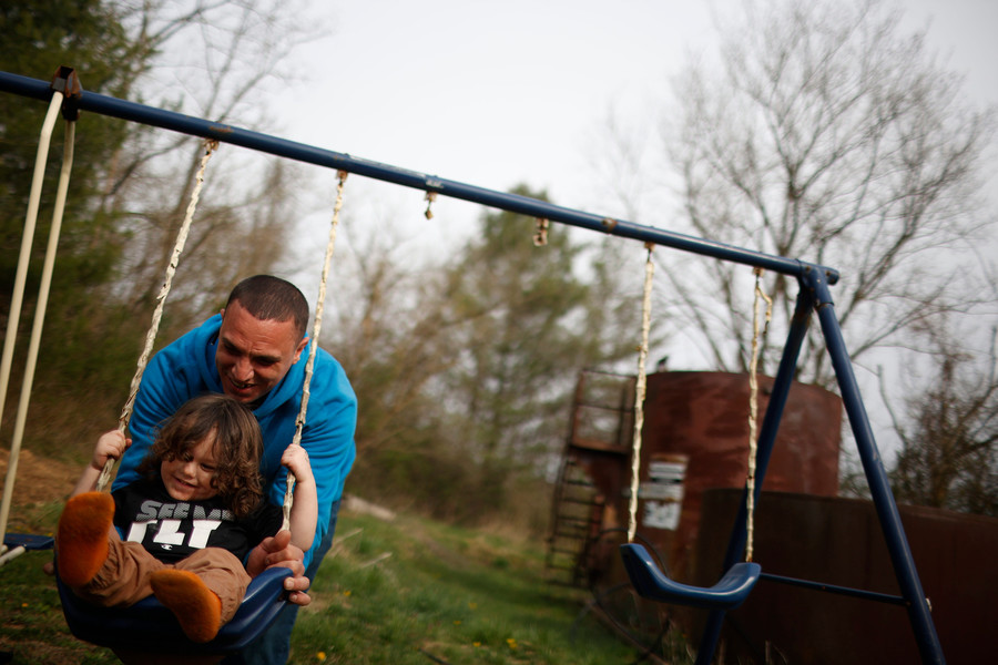 Feature Picture Story - 2nd, “See You When I See You”Zach pushes his nephew Lincoln Singer, 2, on the swing on eastern Weekend. Zach never met Lincoln until he moved back home, which brought more responsibility to not succumb to his former addictions.  (Michael Blackshire / Ohio University)