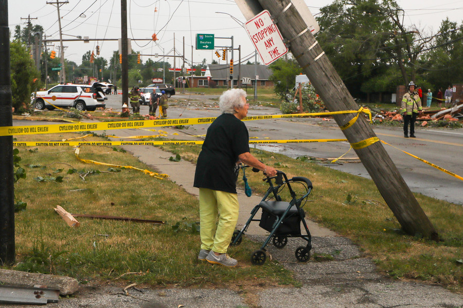 News Picture Story - 2nd, “Tornado”Geraldine Kucharski, 92, walks near the destroyed ProMedica Lab on Suder Avenue on Thursday, June 15, 2023 in Toledo.  (Jonathan Aguilar / The Blade)