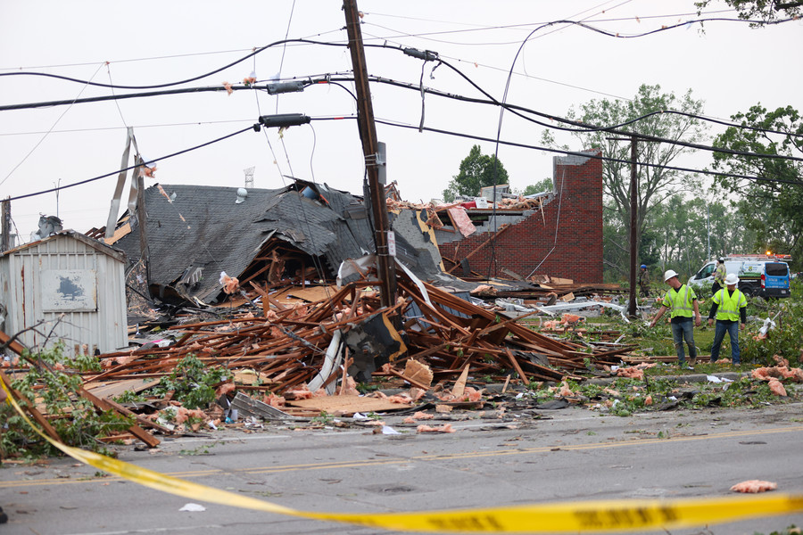 News Picture Story - 2nd, “Tornado”People walk through the destroyed ProMedica Labs building on Suder Avenue on Thursday, June 15, 2023 in Toledo. (Jonathan Aguilar / The Blade)