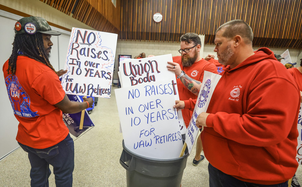 News Picture Story - 3rd, “UAW Strike”From left Jeep employees Kentrail Fickling, Denny Crum, and Tim Kruger organize signs in preparation for a possible strike Friday, September 8, 2023, at the UAW Local 12  in Toledo.  (Jeremy Wadsworth / The Blade)