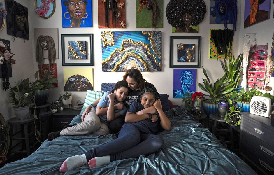 2nd - Photographer of the Year - Large Market Jasmine Wooten sits with her two children Arius Wooten, 8, (left) and Naomi Wooten, 11, on her bed in their home on the East Side of Columbus. Jasmine is an artist, her work hangs on the wall behind her. Emergency SNAP benefits helped to feed her family during the Covid-19 Epidemic. She is a single mom who recently earned her Masters Degree in Social Work from The Ohio State University.  (Brooke LaValley / The Columbus Dispatch)