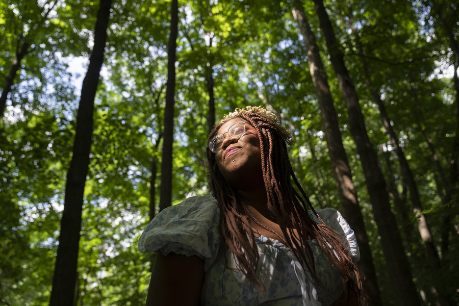 2nd - Photographer of the Year - Large Market Alexis Nicole Nelson, also known as Black Forager, stands for a portrait while foraging in an urban area at Jeffrey Park in Bexley, Ohio on July 21, 2023. Nelson has millions of followers on TikTok, she teaches how to find and prepare common plants in unexpected ways.  (Brooke LaValley / The Columbus Dispatch)