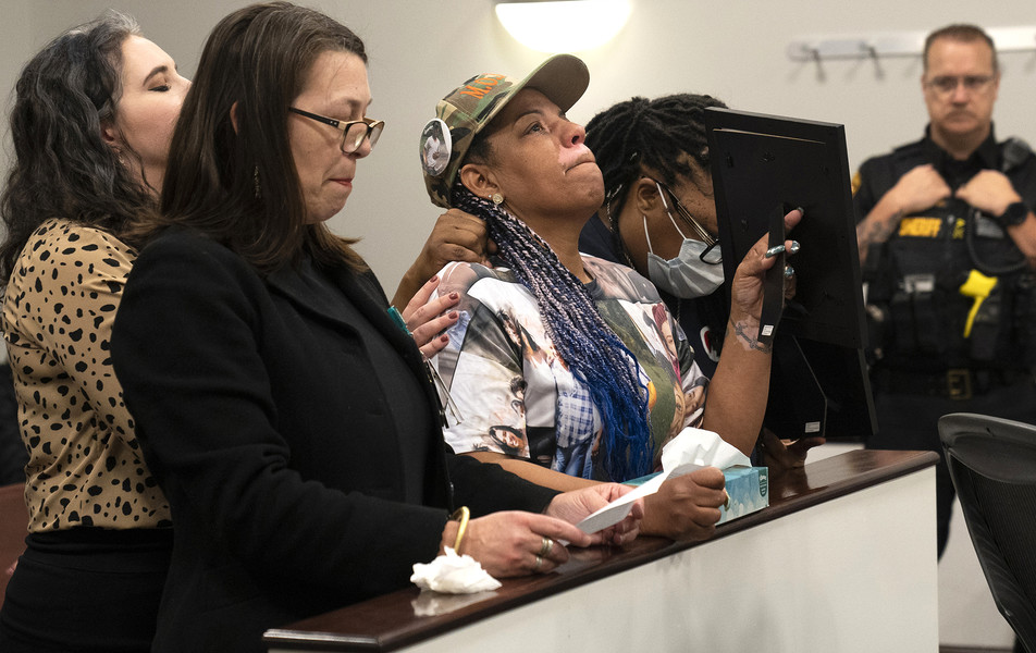 2nd - Photographer of the Year - Large Market Shawna Brady (center) mother of slain 15-year-old TréVon Dickson, becomes emotional Thursday while her victim impact testimony is read before the sentencing of Nasir Ndiaye in Franklin County Court of Common Pleas Juvenile Division. Ndiaye, now 17, was 15 when he fatally shot Dickson in 2021 in an exchange of gunfire that also wounded Ndiaye. Brady is holding up a photo of her son for Ndiaye to see.  (Brooke LaValley / The Columbus Dispatch)