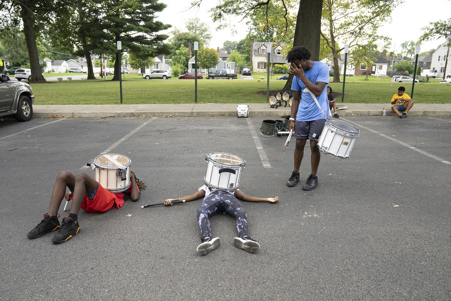 2nd - Photographer of the Year - Large Market Corey Neal, Knya Wilson and Jon Hughes play around during practice outside of the Linden-McKinley STEM Academy. They practice in the parking lot five days a week in the hottest month of the summer.  (Brooke LaValley / The Columbus Dispatch)