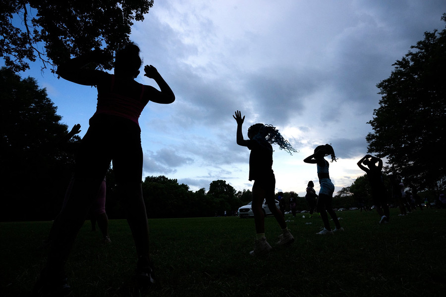 2nd - Photographer of the Year - Large Market Girls from the ICE program dance as the sun sets behind the park. Powerful storms rolled into the Columbus area Thursday evening ending activities and sending people indoors. It was considered a blessing by police because bad weather typically helps slow gun violence. (Brooke LaValley / The Columbus Dispatch)
