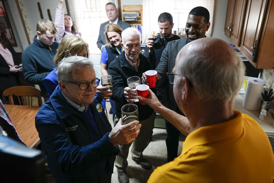 3rd - Photographer of the Year - Large Market Gov. Mike DeWine, Congressman Bill Johnson and EPA administrator Michael Regan toast a glass of tap water with East Palestine resident Andris Baltputnis. Work continues to clean up the vinyl chloride chemical spill from the Norfolk Southern train derailment on Feb. 3.  (Adam Cairns / The Columbus Dispatch)