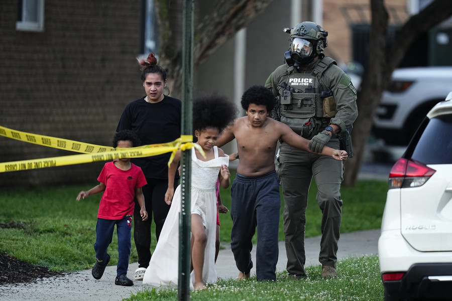 3rd - Photographer of the Year - Large Market Neighbors are evacuated from their nearby apartment as Columbus Police and SWAT officers fired gas cannisters while serving an arrest warrant at a University District apartment.  (Adam Cairns / The Columbus Dispatch)
