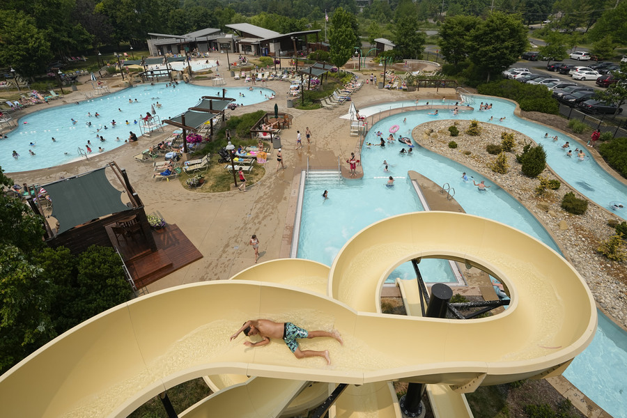 3rd - Photographer of the Year - Large Market Kids and families play at Highlands Park Aquatic Center, in Westerville on June 7. The pool features a lazy river and large water slide. (Adam Cairns / The Columbus Dispatch)