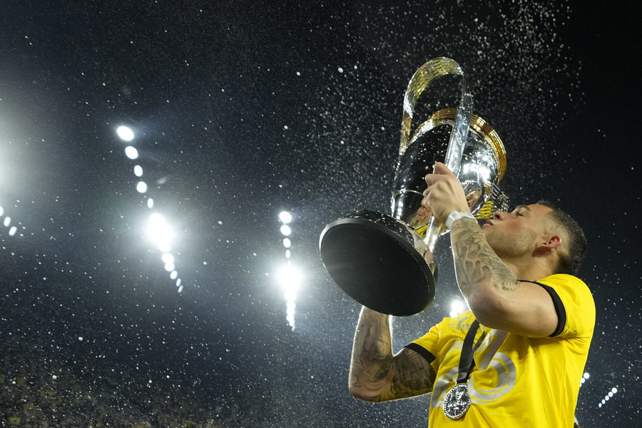 3rd - Photographer of the Year - Large Market Columbus Crew forward Christian Ramirez (17) hoists the Philip J. Anschutz Trophy after defeating the Los Angeles FC in the 2023 MLS Cup championship game at Lower.com Field.  (Adam Cairns / The Columbus Dispatch)