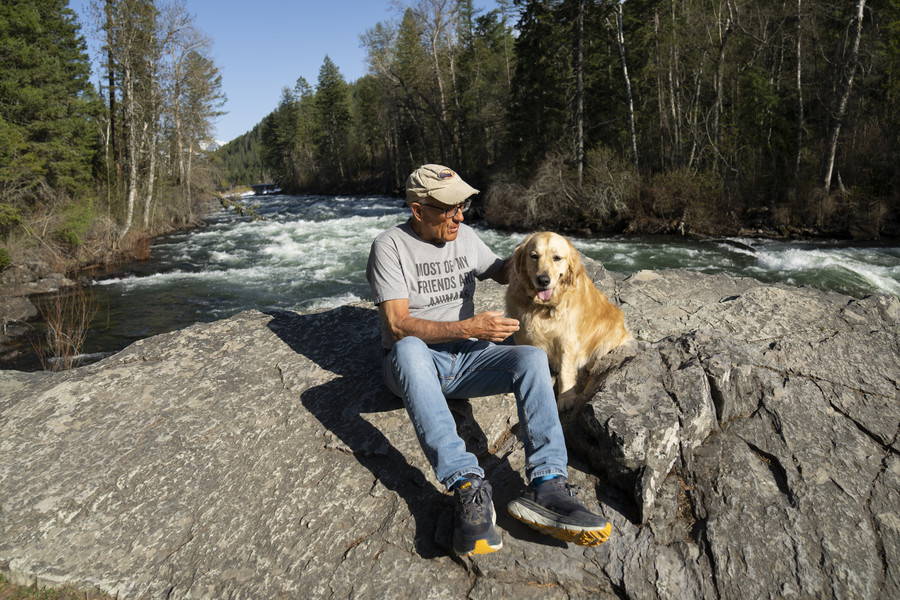 3rd - Photographer of the Year - Large Market Jack Hanna sits with his service dog, Brassy, alongside the Swan River as they take their daily walk along the Bigfork Nature Trail near his Montana home on May 2. Aside from his dog, as well as a couple of donkeys and alpaca on their nearby farm, Jack does not have much interaction with animals anymore.  (Adam Cairns / The Columbus Dispatch)