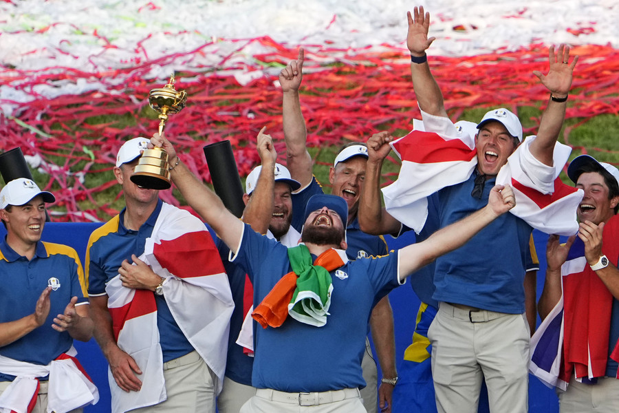 3rd - Photographer of the Year - Large Market Team Europe golfer Shane Lowry and Team Europe celebrates with the Ryder Cup trophy after beating Team USA  during the final day of the 44th Ryder Cup golf competition at Marco Simone Golf and Country Club.  (Adam Cairns / The Columbus Dispatch)