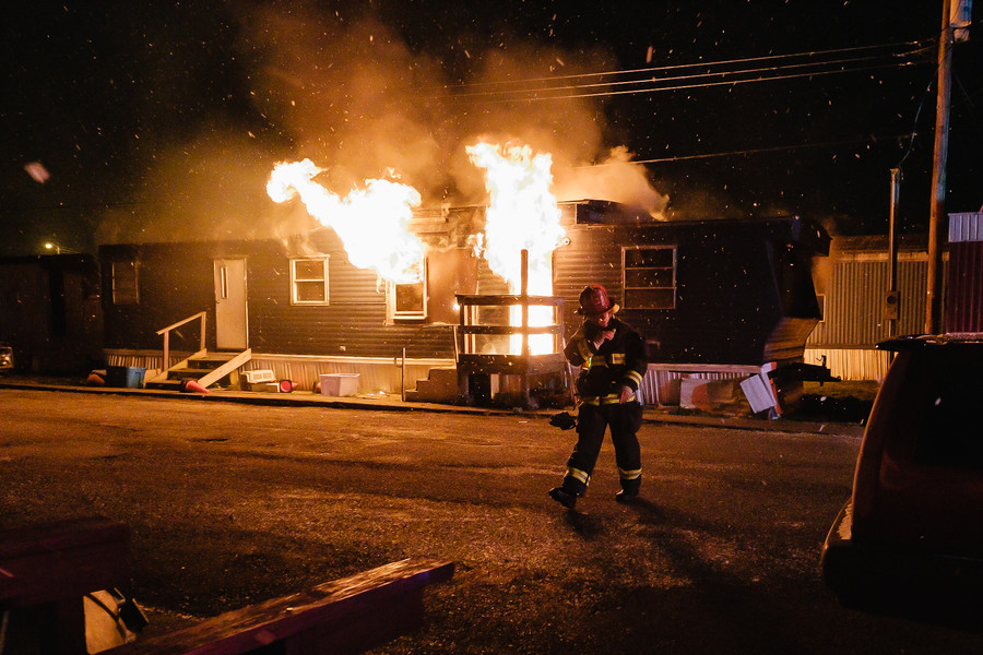 1st - Photographer of the Year - Small Market New Philadelphia Fire Department Captain Steve Wright establishes incident command at the scene of a mobile home fire on 11th Street NW, Friday, Feb. 17 in New Philadelphia. (Andrew Dolph / The Times Reporter)